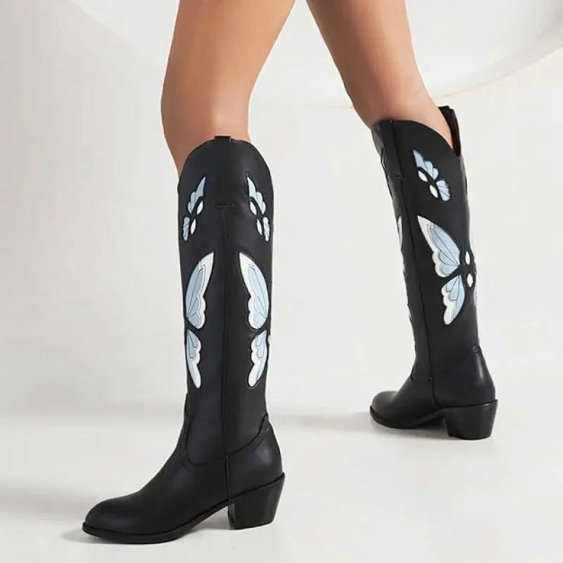 Sandales pour femme Clara Santiag Yehaw en noir et bleu, avec design élégant et détails sophistiqués visible sur la chaussure.