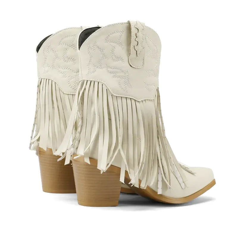 Dalia Santiag pour femme Yehaw en cuir beige avec talons, style cowboy, visible sur une femme portant ces bottes.